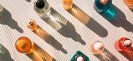 Colorful perfume bottles sitting on a table