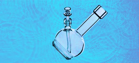 Clear glass water pipe on a blue background