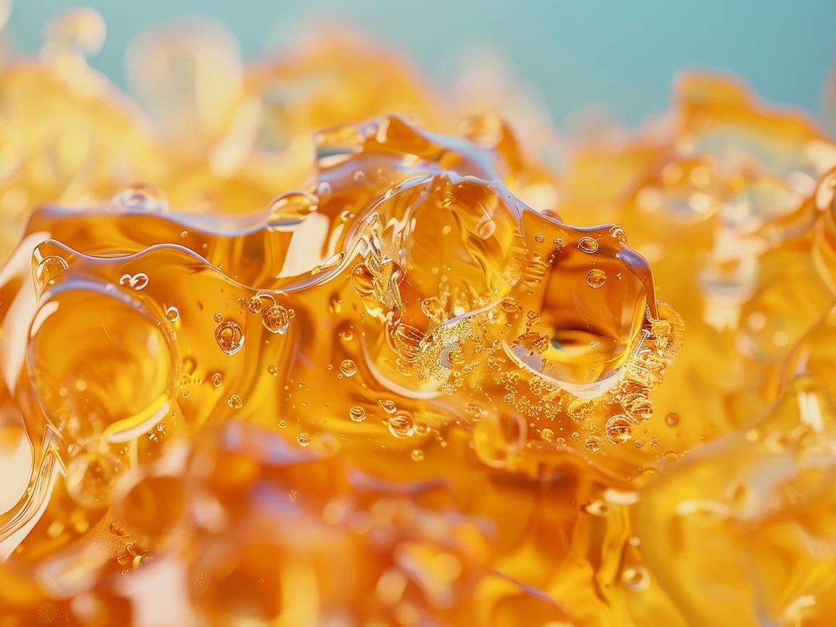 close up of amber-colored THC concentrate